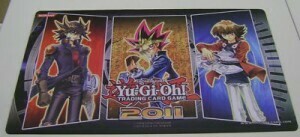 Win-A-Mat 2011 "Yugi, Jaden & Yusei" Playmat